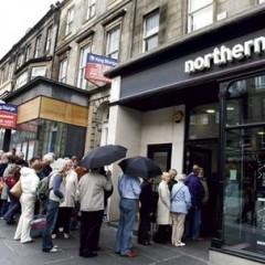 Northern Rock customers queue outside the Castle Street branch, in Edinburgh, Scotland